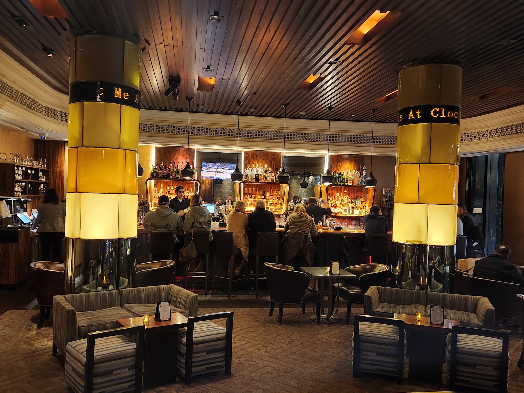 Clock Bar's room reads as polished and hotel-based, which makes it better for a dressed-up first round than for a loud all-night bar crawl.