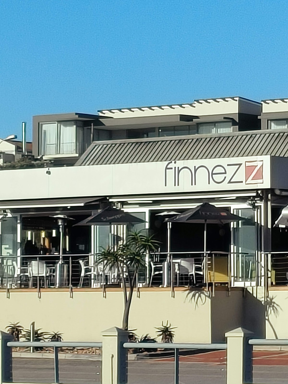 A first look at Finnezz Restaurant & Cocktail Cafe, showing the dining room and the kind of stop this is in South End, Gqeberha.